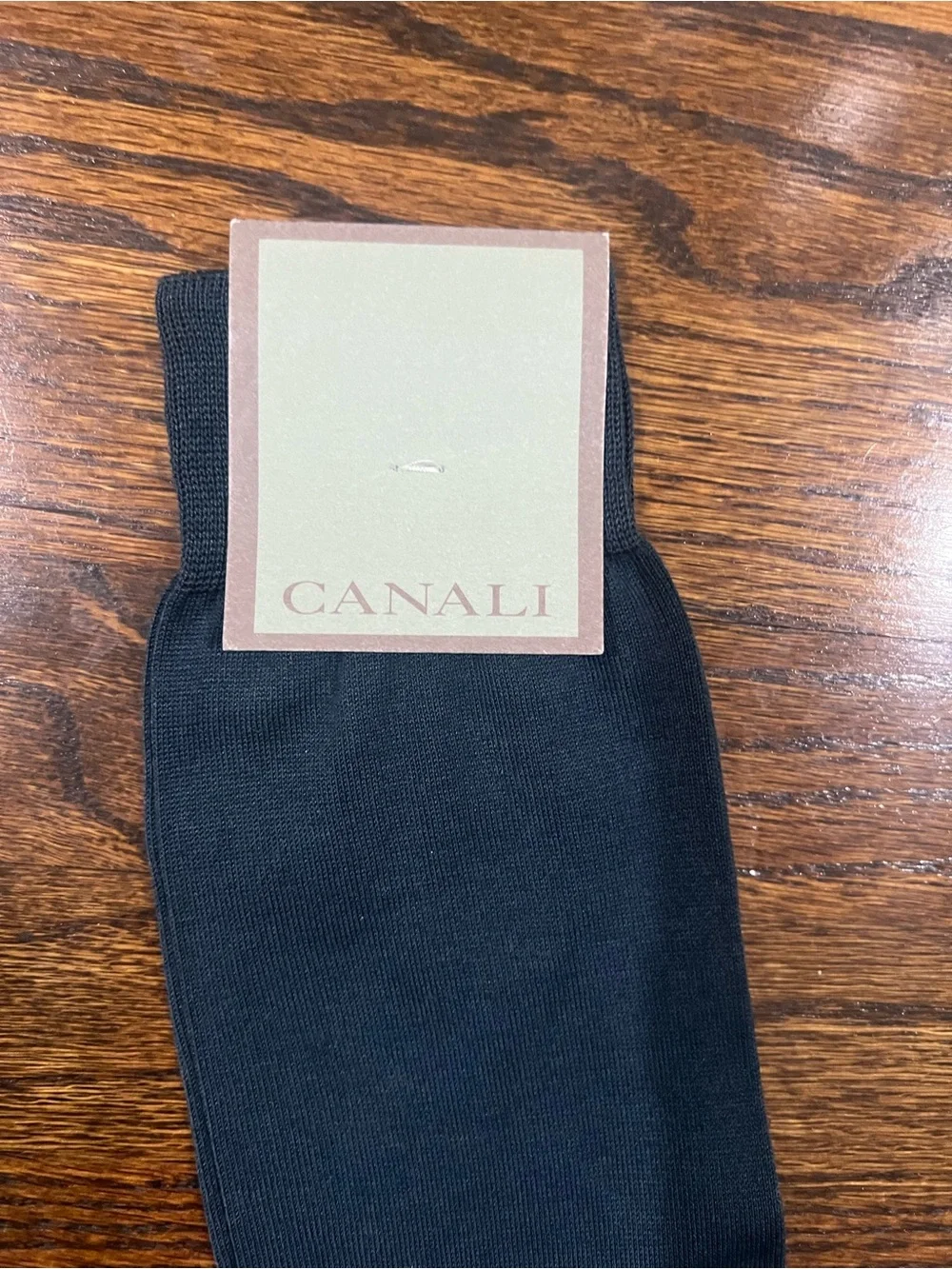 Canali dress socks featuring the brand's logo printed along the side.